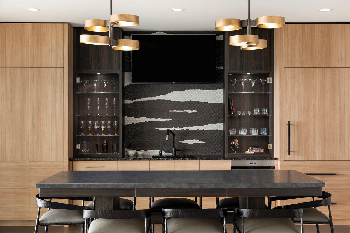 Contemporary home bar with minimalist design and sleek cabinetry, designed by MA Peterson in Twin Cities