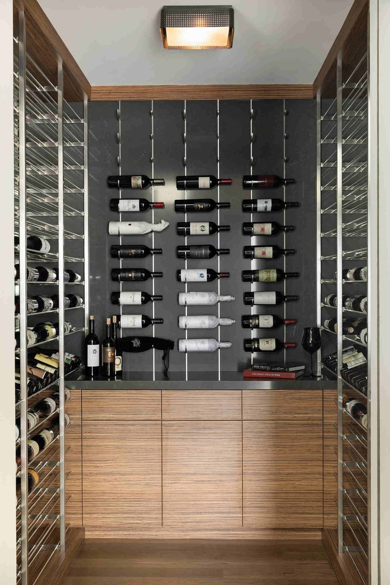 Modern wine storage room with minimalist shelving and sleek wood finishes, designed by MA Peterson in Twin Cities