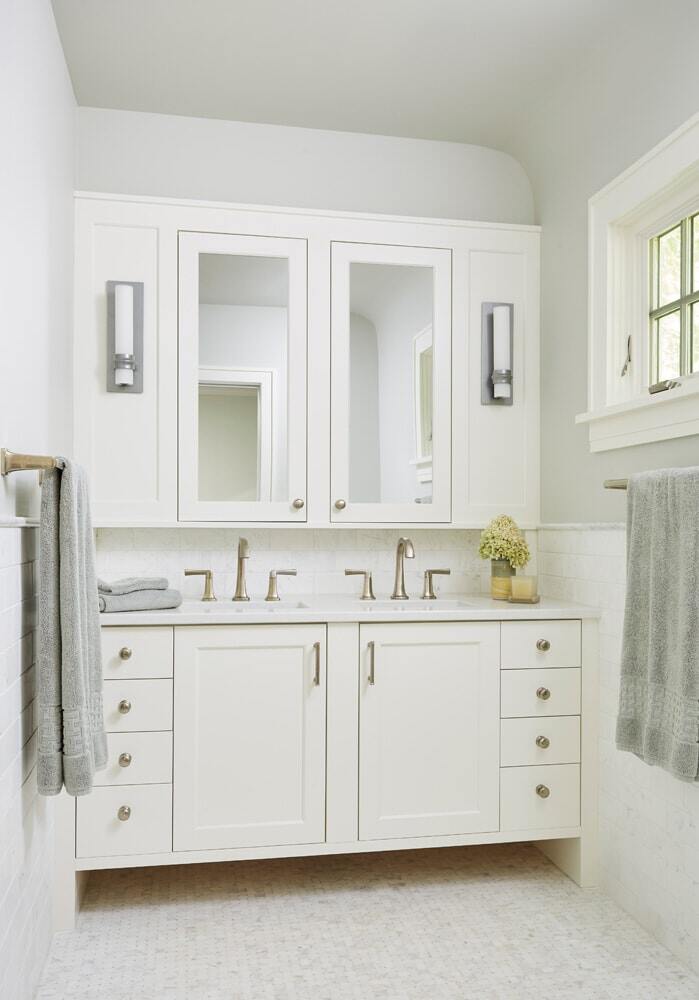 Twin Cities bathroom remodel with white vanity and double sinks by MA Peterson