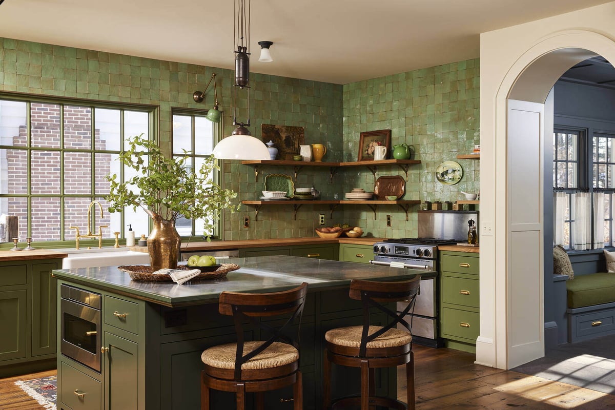 Vintage-inspired kitchen with green cabinetry and open shelving in a Twin Cities home remodel by MA Peterson
