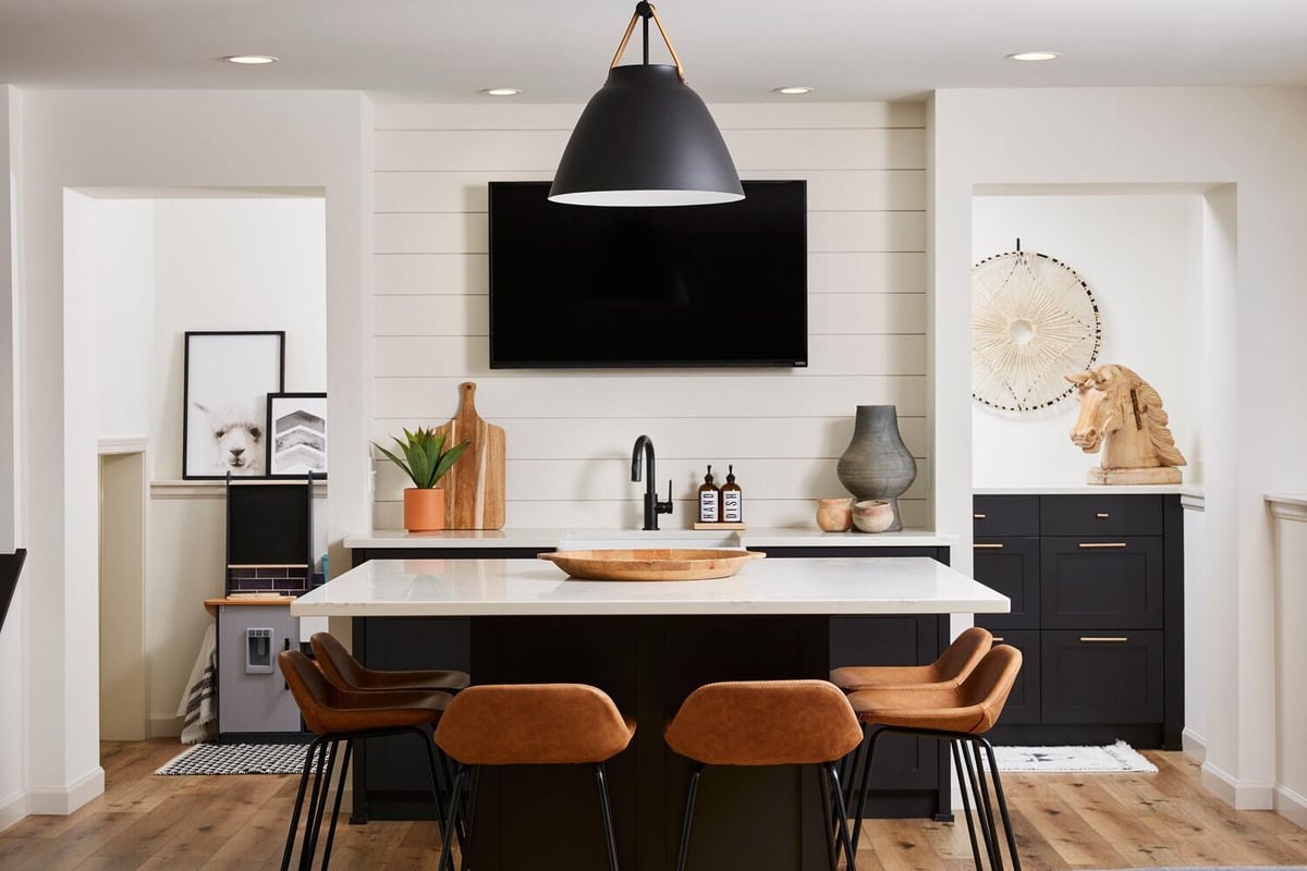 Modern kitchen island in a remodeled lower level by MA Peterson in the Twin Cities