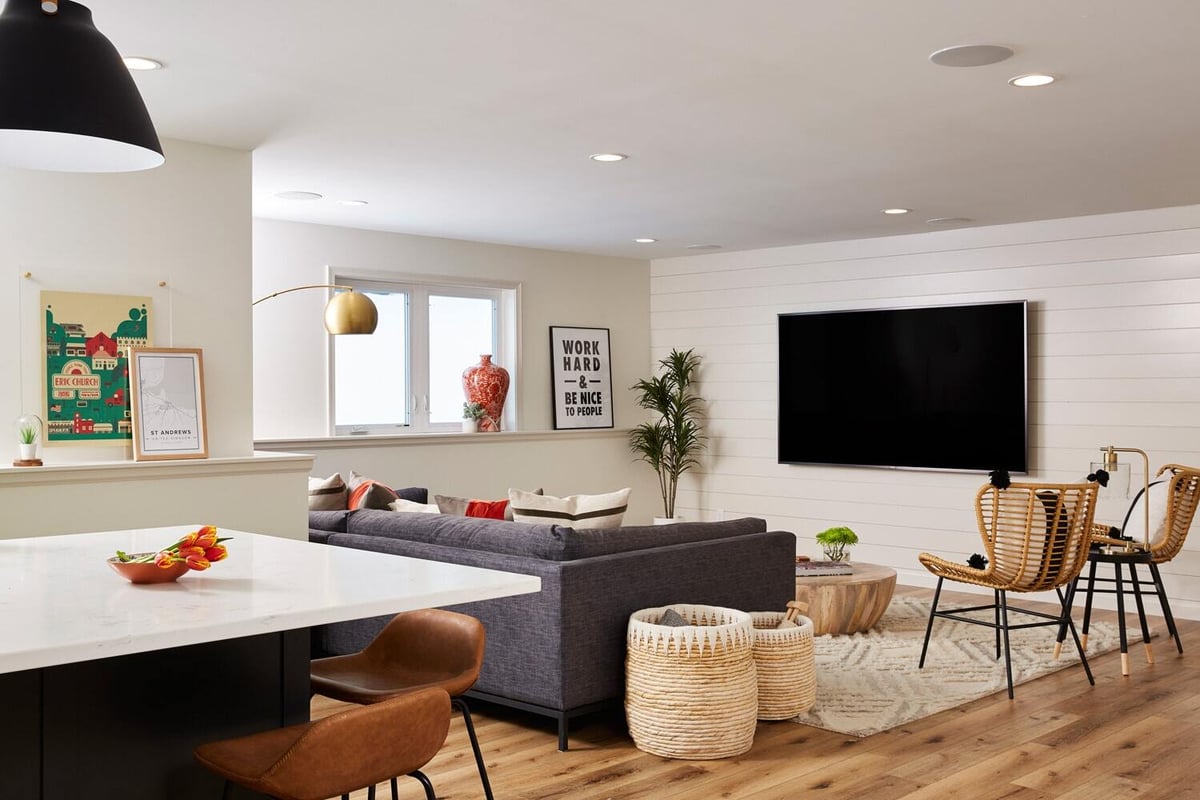 Modern lower level living room with shiplap walls by MA Peterson in the Twin Cities