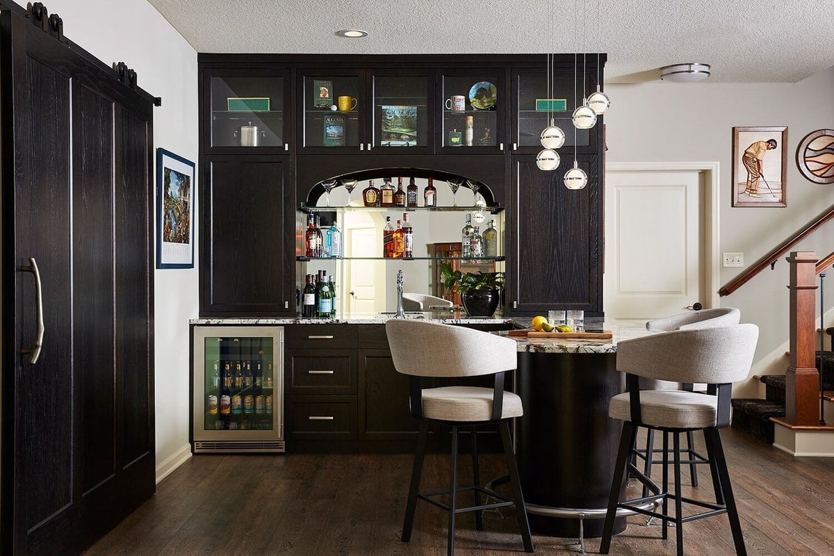 Sophisticated home bar area in a Twin Cities lower level remodel by MA Peterson