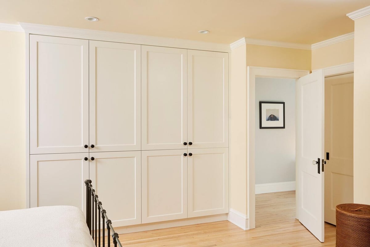 Bright bedroom with custom white cabinetry by MA Peterson in the Twin Cities