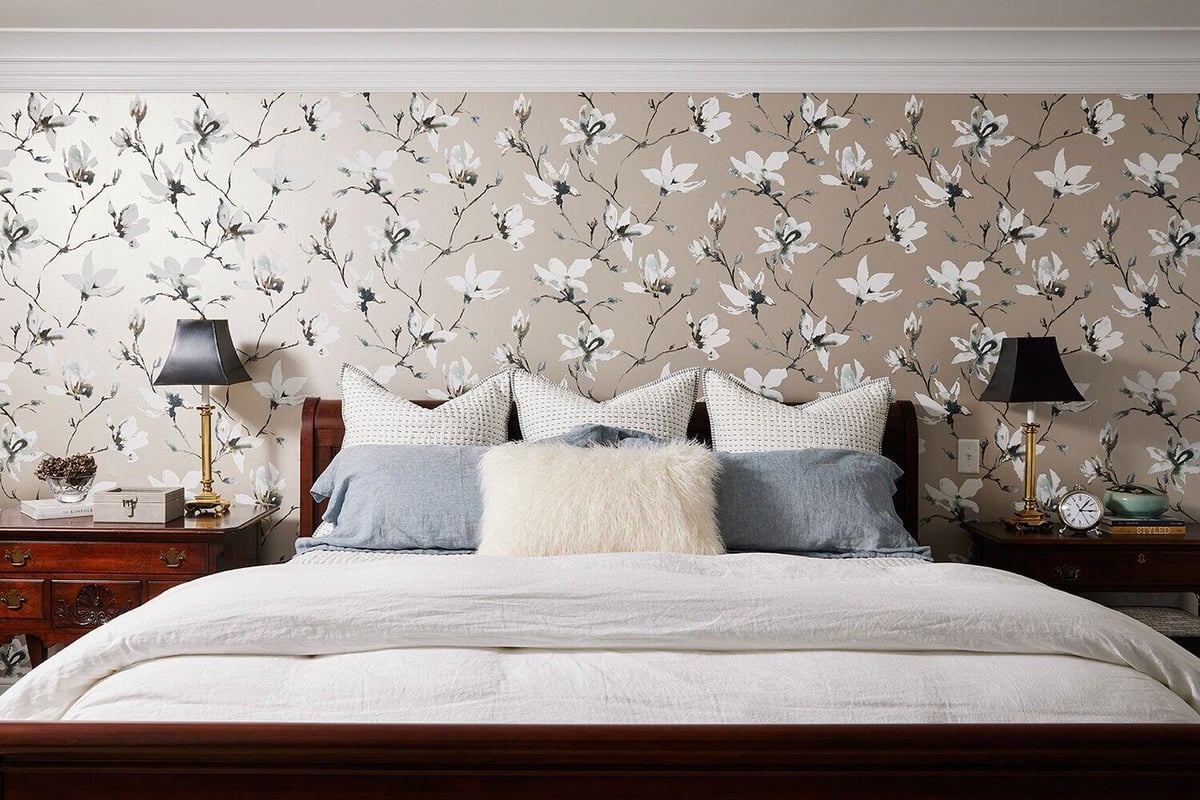 Cozy bedroom with a floral accent wall and stylish decor, designed by MA Peterson, Twin Cities