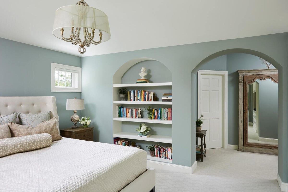 Elegant Twin Cities bedroom remodel by MA Peterson featuring built-in bookshelves