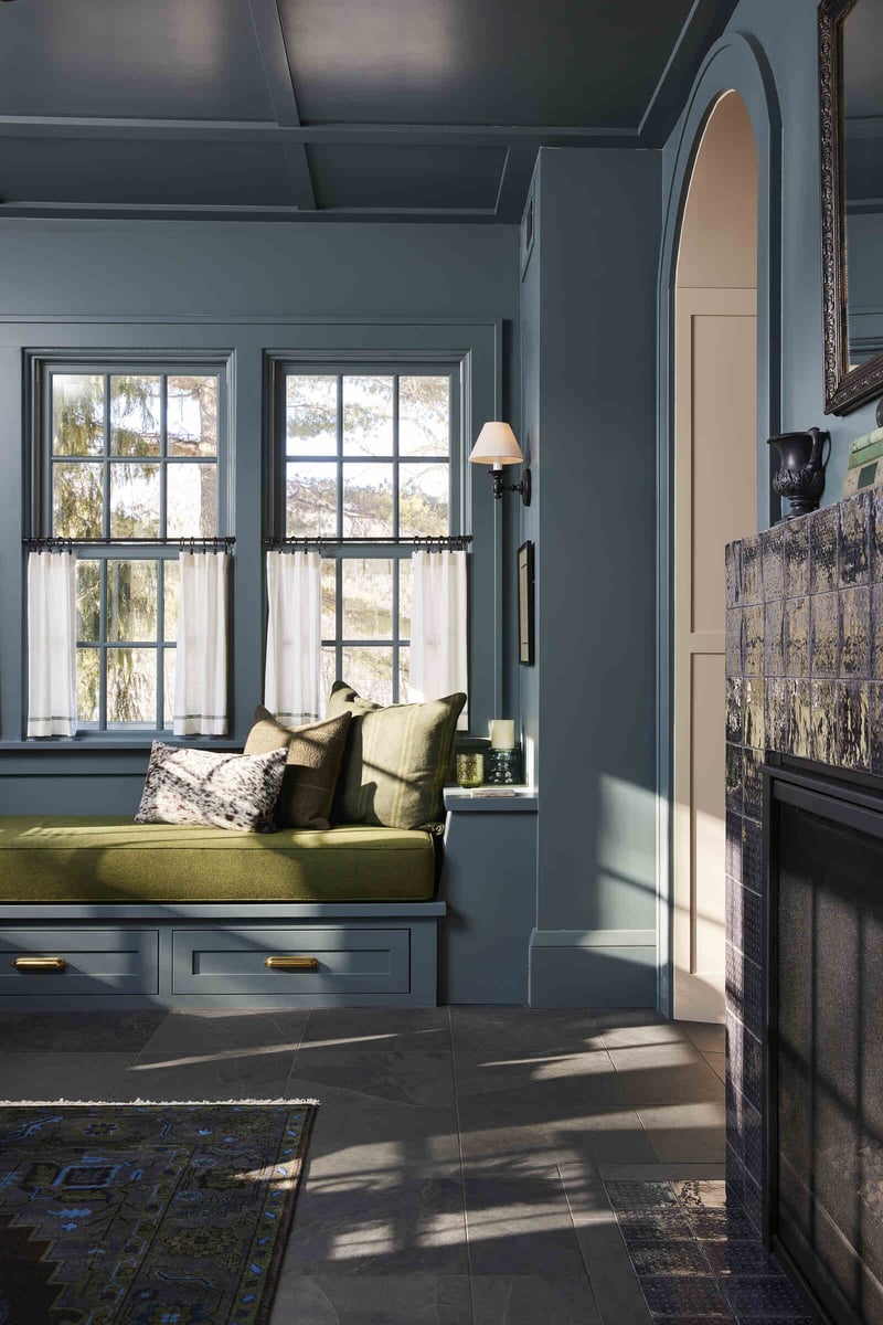 Cozy reading nook with green cushions in a custom home remodel by MA Peterson in the Twin Cities