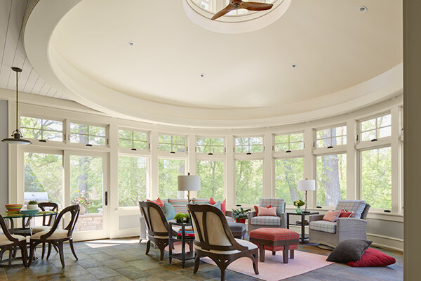 Spacious sunroom with large windows and a round ceiling, designed by MA Peterson in the Twin Cities