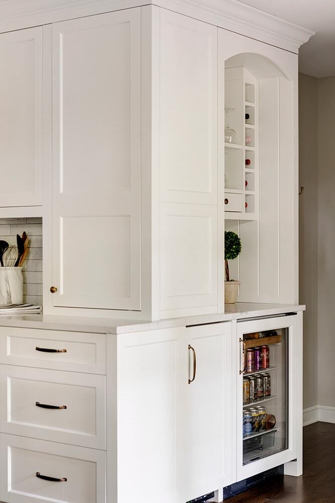 Detail view of kitchen storage and beverage fridge, part of a remodel by MA Peterson in Twin Cities