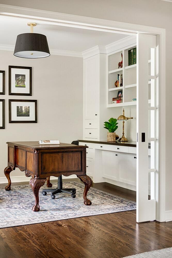 Home office remodel with custom cabinetry and antique desk by MA Peterson in Twin Cities