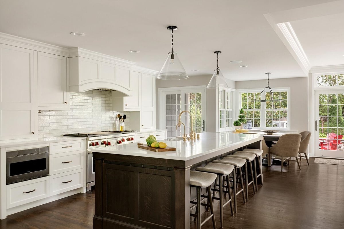 Open-concept kitchen with island and high-end finishes by MA Peterson, Twin Cities