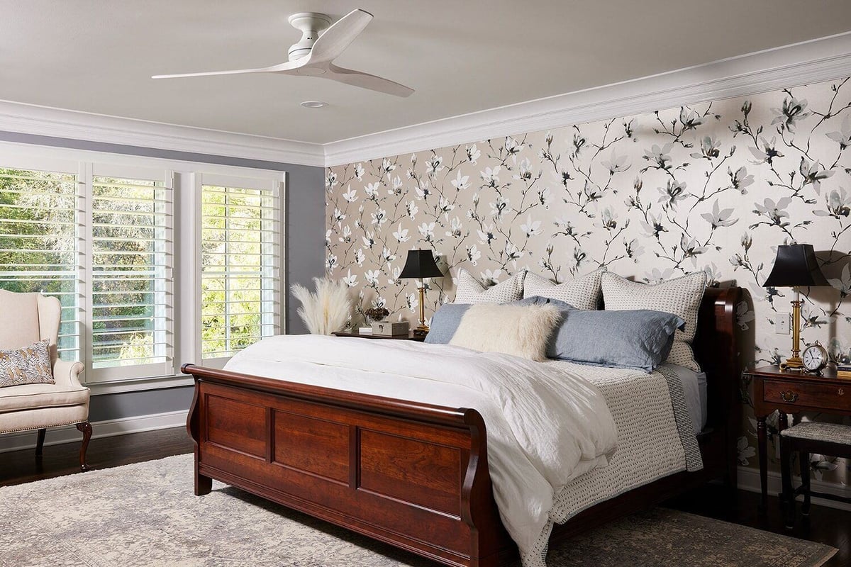 Charming bedroom with stylish wallpaper and comfortable furnishings, designed by MA Peterson in Twin Cities