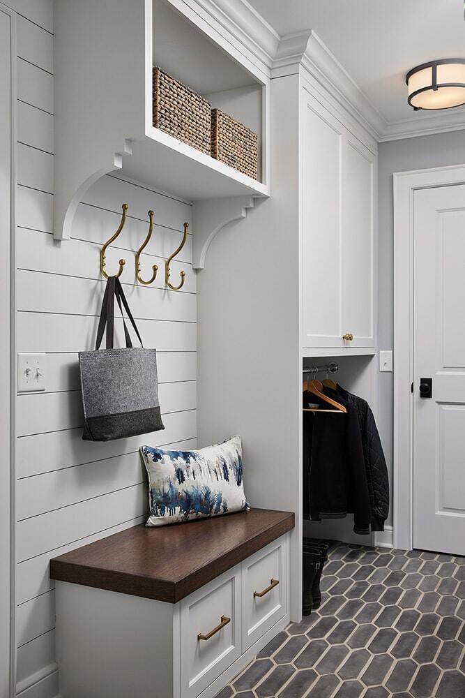 Functional mudroom with bench seating and storage, remodeled by MA Peterson in Twin Cities
