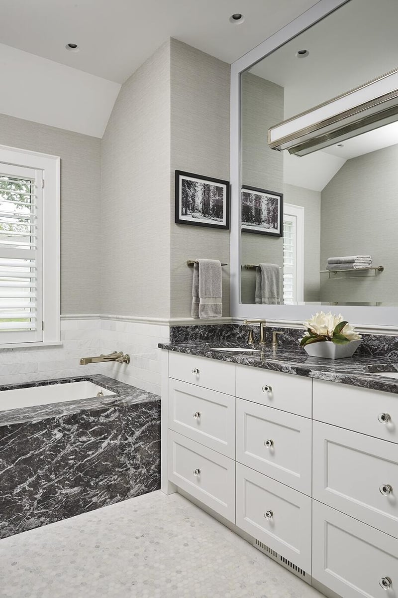 Bathroom with marble countertop and bathtub in Coastal Chic on the Lake home by MA Peterson, Twin Cities