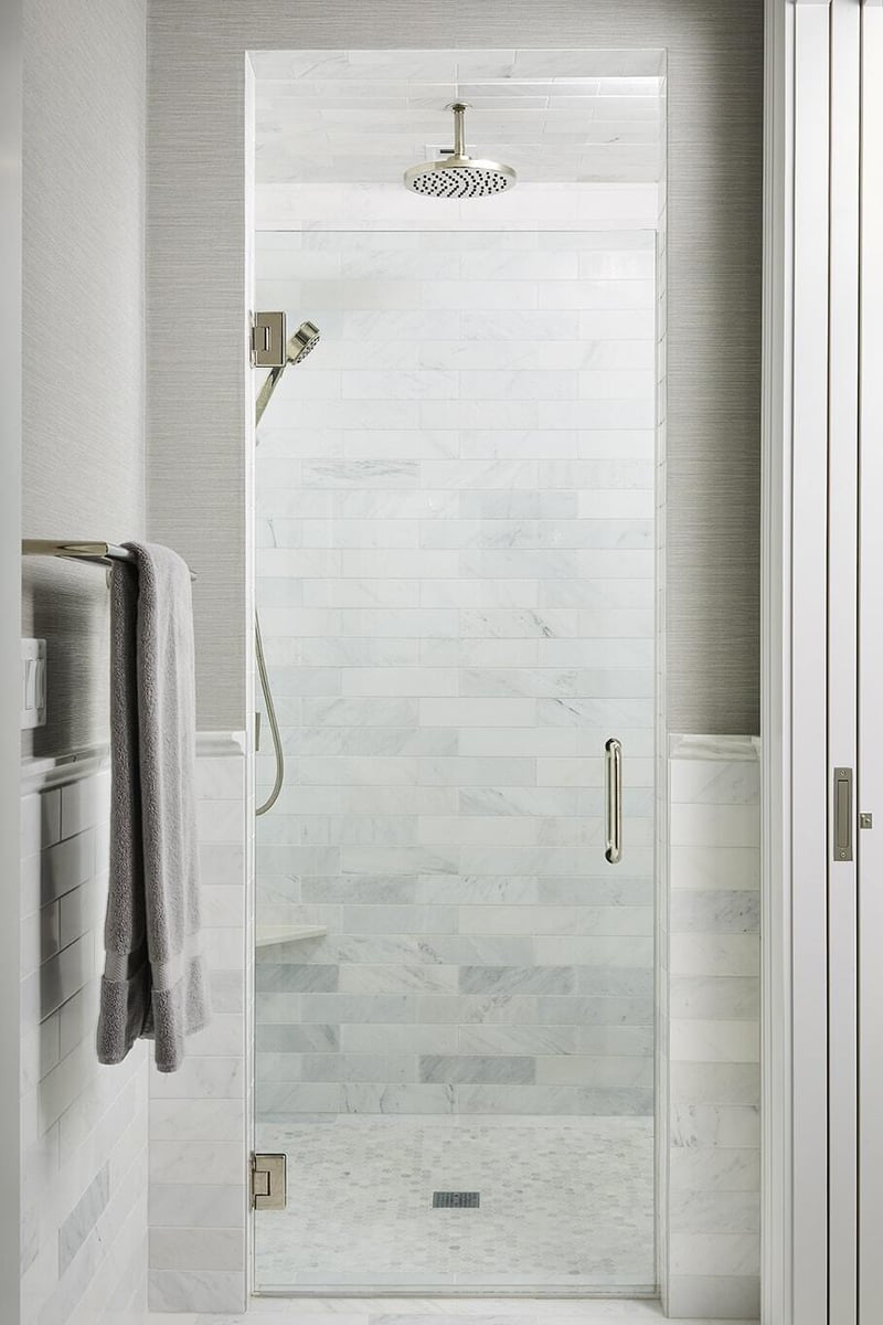 Coastal Chic bathroom featuring a marble vanity and bathtub, designed by MA Peterson in the Twin Cities