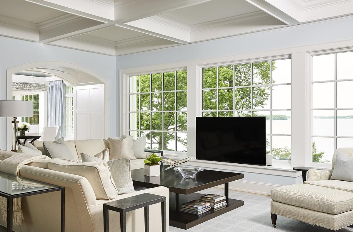 Living room with large TV and lake view in Coastal Chic on the Lake home by MA Peterson, Twin Cities