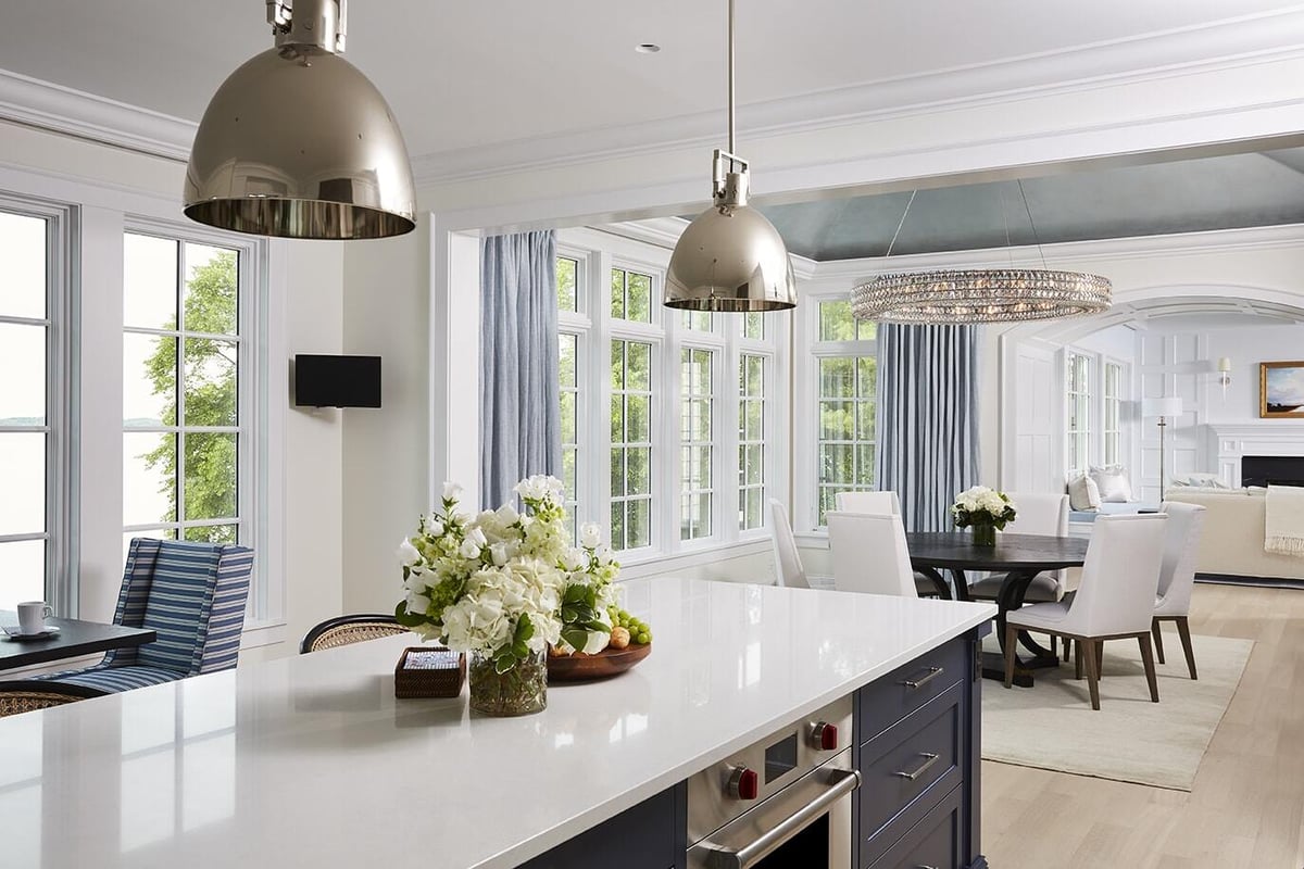 Open-plan kitchen and dining area with lake view in Coastal Chic on the Lake home by MA Peterson, Twin Cities