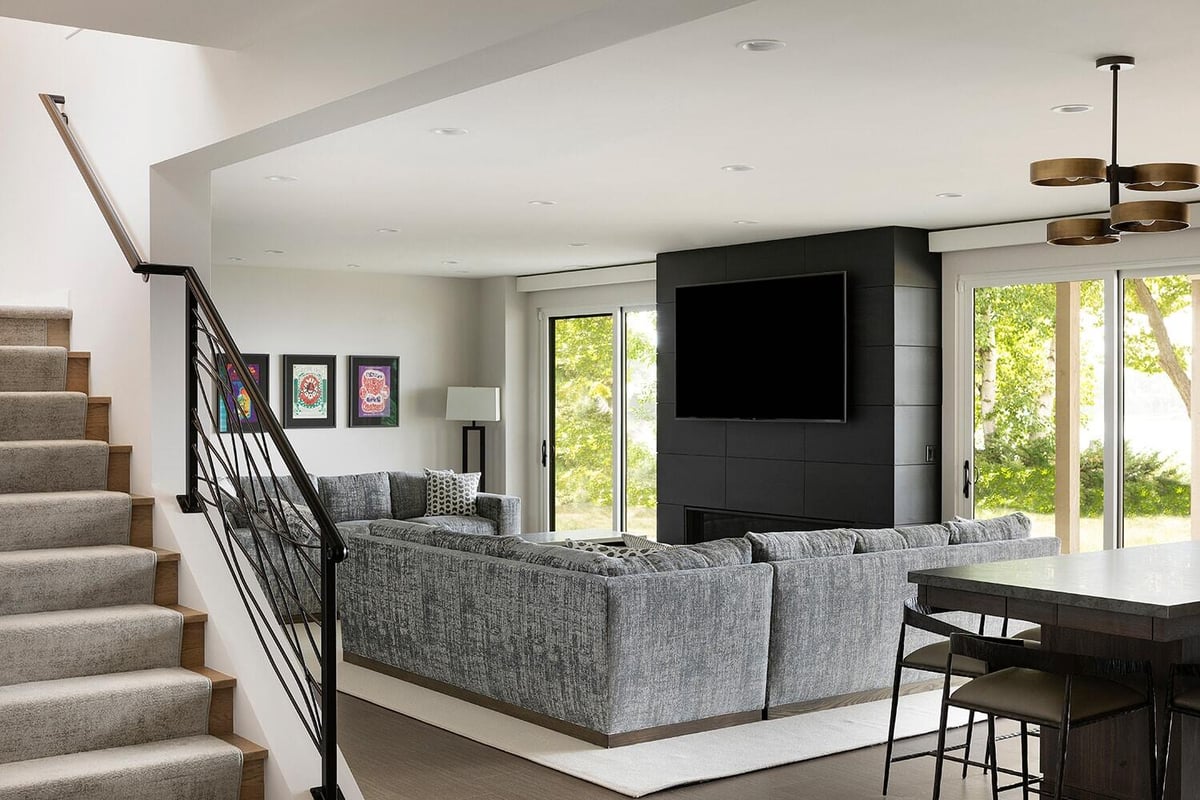 Modern living room with a grey sectional and stylish decor, completed by MA Peterson in Twin Cities