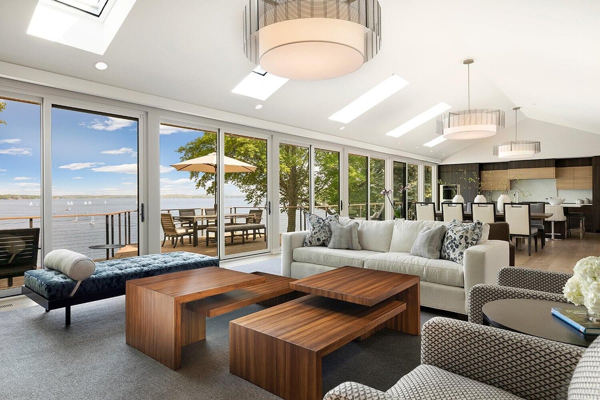 Open-plan living and dining area with lake views, remodeled by MA Peterson in Twin Cities