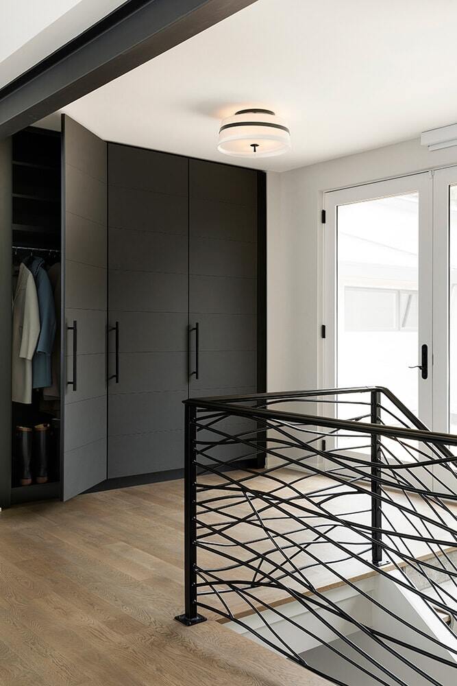 Stylish storage area featuring sleek black cabinets, remodeled by MA Peterson in Twin Cities