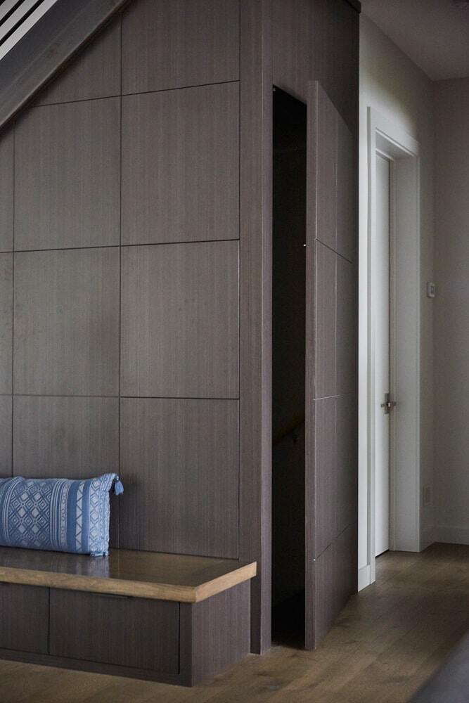 Modern entry with hidden cabinetry and bench seat in Lake Cornelia remodel by MA Peterson, Twin Cities