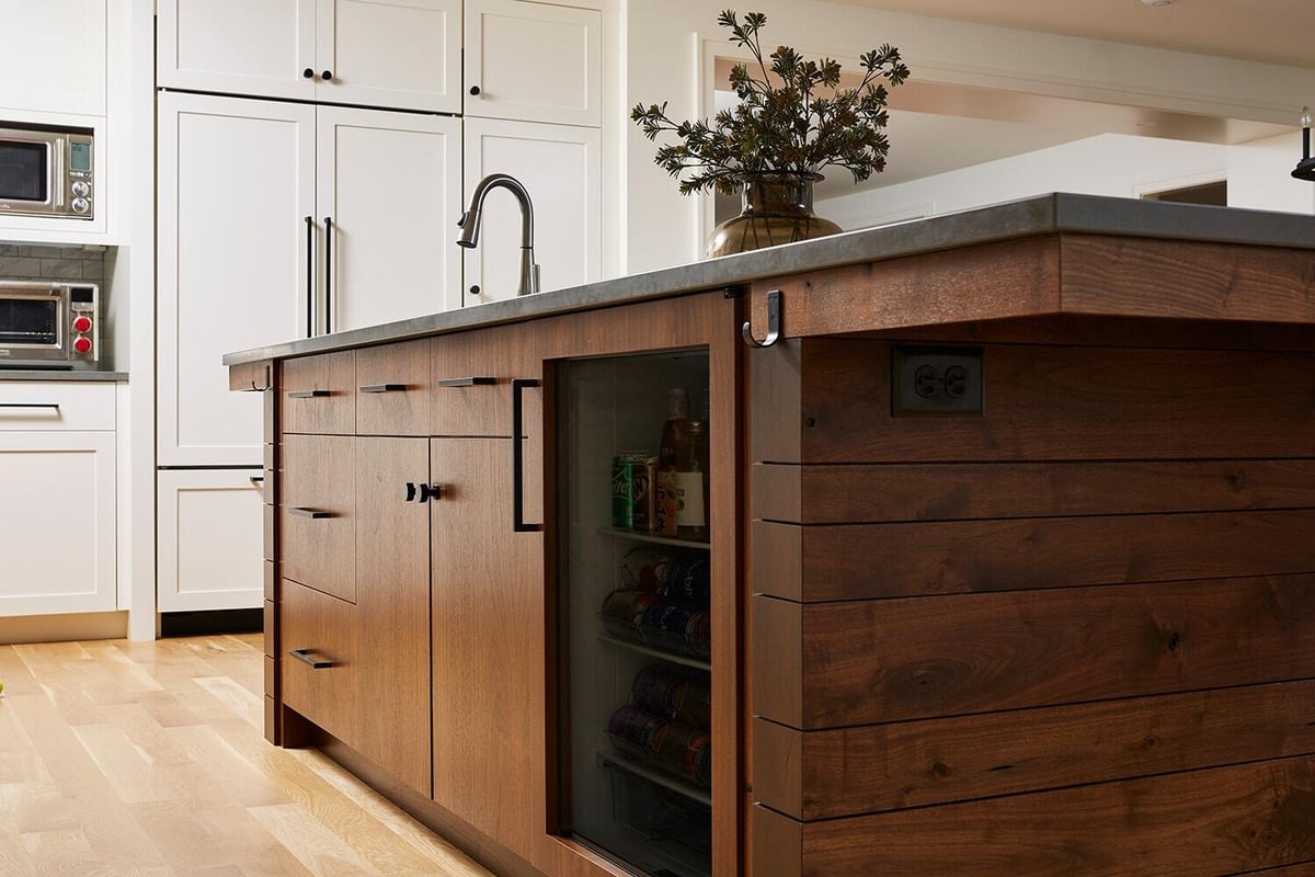 Detailed view of kitchen island with built-in storage by MA Peterson in Twin Cities