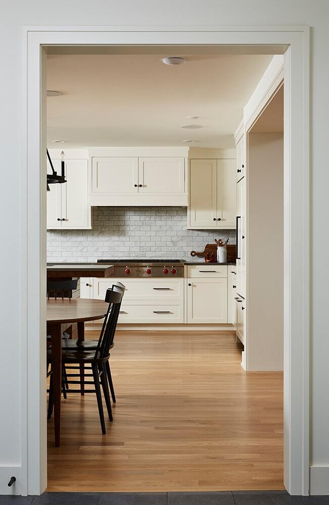 Dining area leading to a remodeled kitchen by MA Peterson in Twin Cities