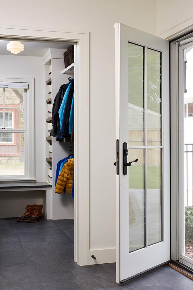 Mudroom entrance with coat storage in Twin Cities home remodeled by MA Peterson