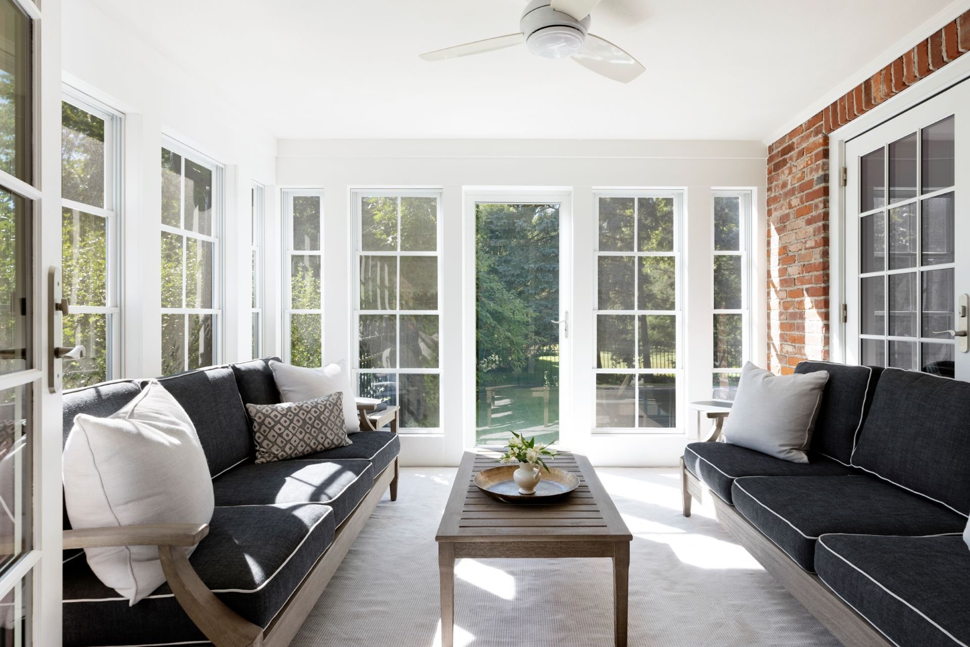 Updated porch with new windows and refreshed finishes, perfect for year-round relaxation.
