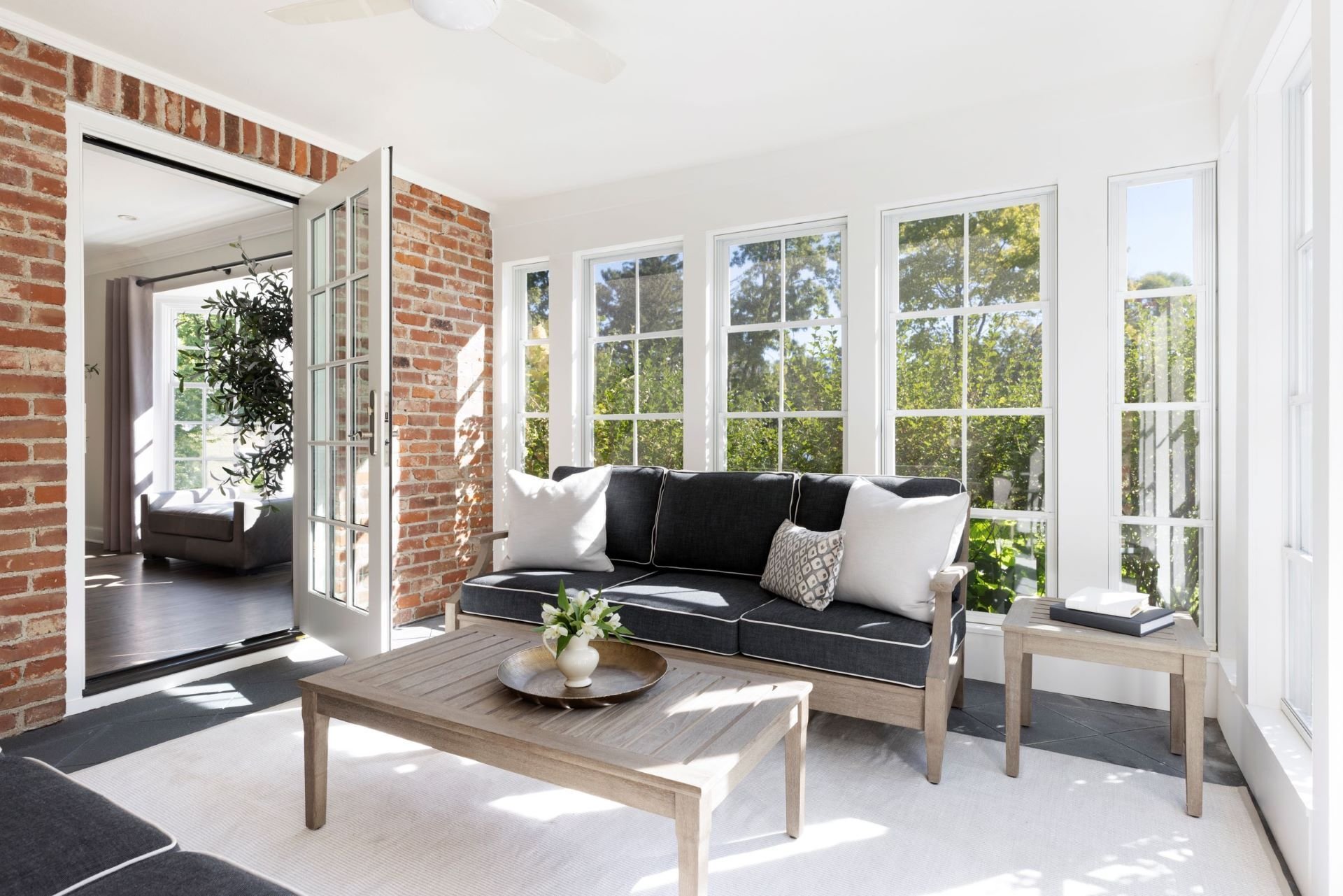 Porch renovation in Edina featuring full window replacement to maximize light and views.
