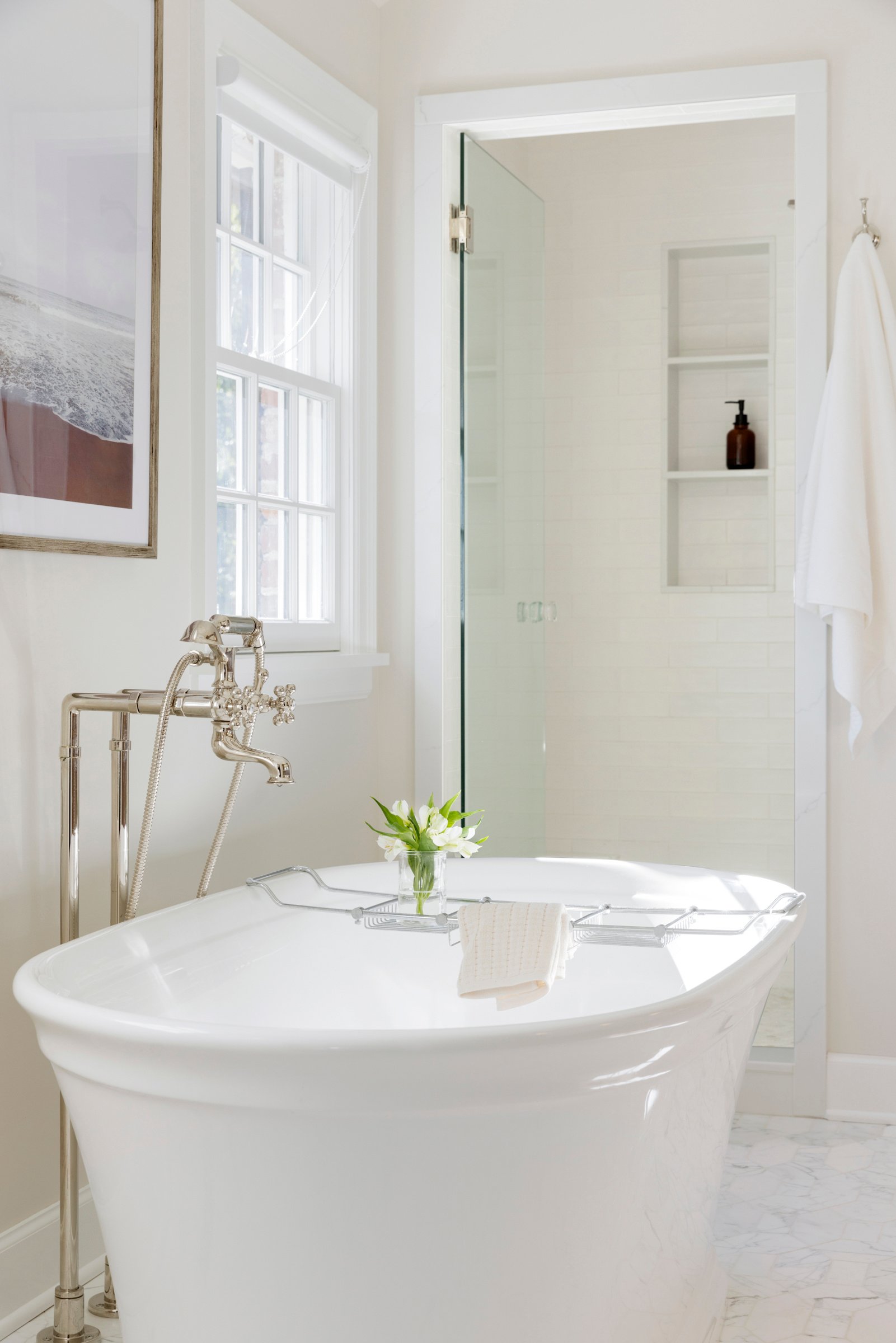 Primary bathroom remodel in Edina with freestanding tub, custom vanity, and natural light.
