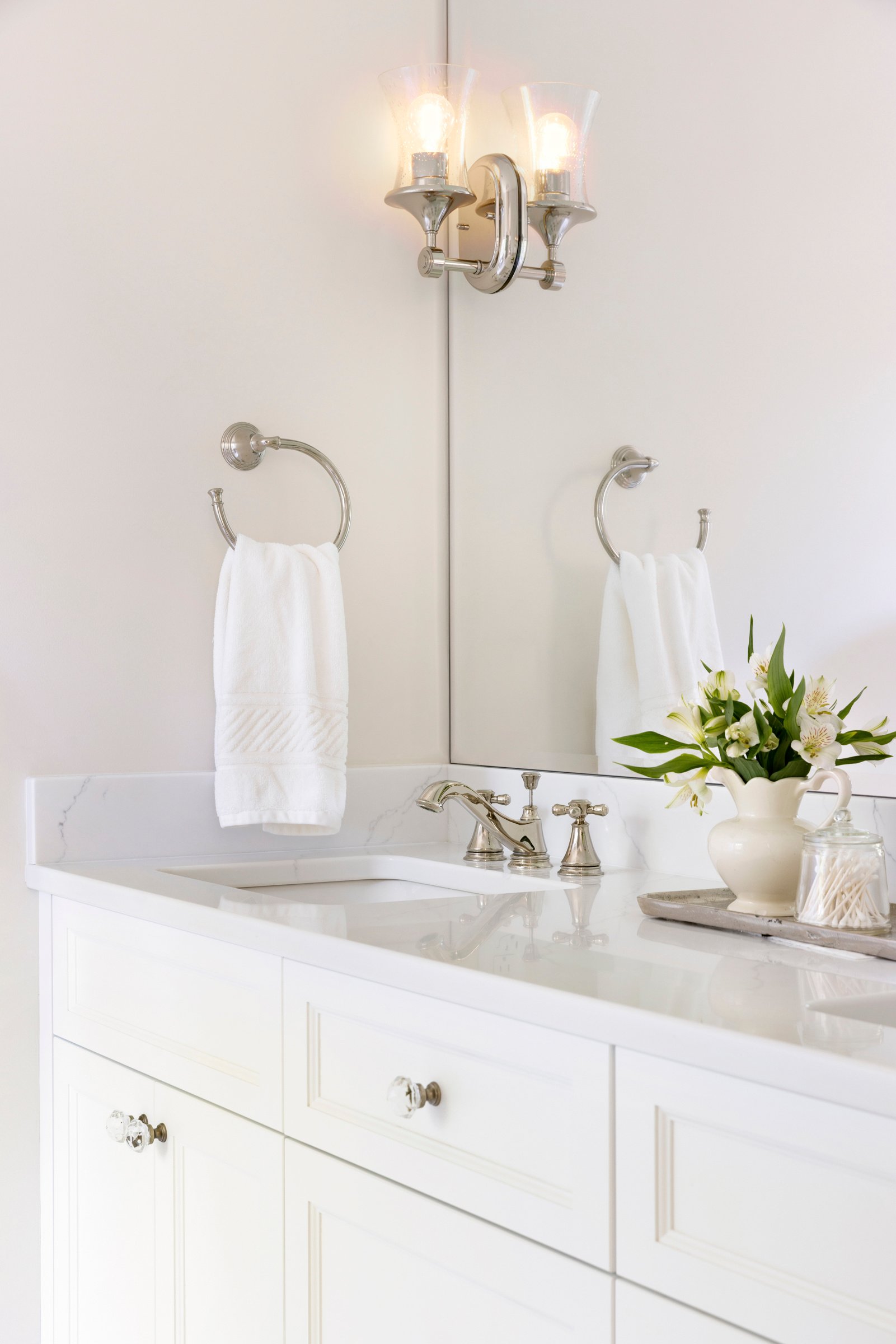 Updated guest bathroom with clean lines, warm finishes, and functional layout.